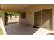 Covered patio area with tile flooring and sliding glass door at 6758 W Quail Ave, Glendale, AZ 85308