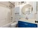 Stylish bathroom with updated vanity, mirror, lighting, and a shower-tub combination at 723 N Joshua Tree Ln, Gilbert, AZ 85234