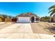 Charming single-story home features a well-manicured lawn and attached two-car garage at 723 N Joshua Tree Ln, Gilbert, AZ 85234