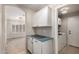 Laundry room with ample cabinet space and a countertop for folding and organizing clothes at 723 N Joshua Tree Ln, Gilbert, AZ 85234