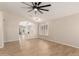 Spacious living room features neutral paint, wood floors, and ample natural light at 723 N Joshua Tree Ln, Gilbert, AZ 85234