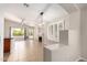 Open-concept living room with a fireplace, tile floors, and an outdoor view at 723 N Joshua Tree Ln, Gilbert, AZ 85234