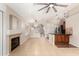 Open living area with tiled floors, fireplace, and a seamless transition to the kitchen at 723 N Joshua Tree Ln, Gilbert, AZ 85234