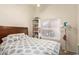 Bedroom with natural light from the window next to the full sized bed at 7603 W Oraibi Dr, Glendale, AZ 85308