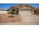 Charming single-story home with a well-maintained yard and attached two-car garage at 7603 W Oraibi Dr, Glendale, AZ 85308