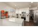 Bright, updated kitchen with white cabinets, stainless steel appliances, and granite countertops at 7603 W Oraibi Dr, Glendale, AZ 85308