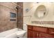 Bathroom showcasing a shower over tub, granite counters, and decorative backsplash at 9559 W Runion Dr, Peoria, AZ 85382