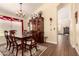 Dining room featuring wood floors, vaulted ceilings, lots of natural light and seating for six at 9559 W Runion Dr, Peoria, AZ 85382