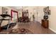 Dining room featuring wood floors, vaulted ceilings, lots of natural light and seating for six at 9559 W Runion Dr, Peoria, AZ 85382
