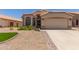Charming single-story home featuring a well-maintained front yard and a two-car garage at 9559 W Runion Dr, Peoria, AZ 85382