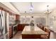 Bright kitchen boasts stainless steel appliances, granite countertops and a central island with bar seating at 9559 W Runion Dr, Peoria, AZ 85382