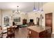 Open concept living room with wood flooring and natural light, adjoining dining space at 9559 W Runion Dr, Peoria, AZ 85382