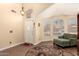 Living room featuring wood floors, lots of natural light and a chaise lounge at 9559 W Runion Dr, Peoria, AZ 85382