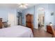 Comfortable main bedroom with wood floors, stylish decor, and access to an en-suite bathroom at 9559 W Runion Dr, Peoria, AZ 85382