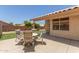 Covered patio with outdoor furniture, low-maintenance turf and view of yard at 9559 W Runion Dr, Peoria, AZ 85382