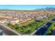 An aerial shot of a new, Primary-planned community with neatly arranged homes and green spaces at 12122 W Levi Dr, Avondale, AZ 85323