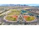 An aerial view displays baseball fields and other sports amenities, within a vibrant community at 12122 W Levi Dr, Avondale, AZ 85323