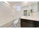 Pristine bathroom with a combined shower and tub, modern vanity, and bright lighting, offering a comfortable experience at 12122 W Levi Dr, Avondale, AZ 85323