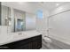 Modern bathroom featuring a sleek vanity, ample counter space, and a shower-tub combination at 12122 W Levi Dr, Avondale, AZ 85323