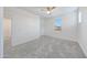 Bright bedroom with plush carpeting and a window providing natural light at 12122 W Levi Dr, Avondale, AZ 85323