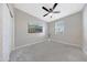 Bright bedroom features neutral walls, modern ceiling fan and new carpet at 12122 W Levi Dr, Avondale, AZ 85323