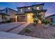 Charming two-story home with a well-manicured front yard and a welcoming entrance at 12122 W Levi Dr, Avondale, AZ 85323