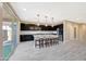Modern kitchen boasts a large center island, stainless steel appliances, and sleek dark cabinetry at 12122 W Levi Dr, Avondale, AZ 85323