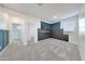 Spacious loft with neutral carpet, a TV, and access to other rooms at 12122 W Levi Dr, Avondale, AZ 85323
