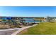 Community playground featuring slides, shade structures, lake views, and picnic area at 12122 W Levi Dr, Avondale, AZ 85323