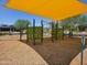 Shaded playground featuring climbing structure and protective ground cover at 12122 W Levi Dr, Avondale, AZ 85323
