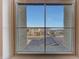 A clear view from the window, showcasing the neighborhood and blue skies at 12122 W Levi Dr, Avondale, AZ 85323