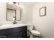Bathroom with black vanity and a black frame mirror at 1353 W Kiowa Ave, Mesa, AZ 85202
