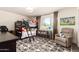Spacious bedroom featuring a bunk bed, and a cozy recliner at 1353 W Kiowa Ave, Mesa, AZ 85202