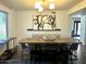 Dining room featuring a modern light fixture and large painting, perfect for entertaining at 1353 W Kiowa Ave, Mesa, AZ 85202