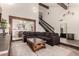 Open-concept living room with wood beams, high ceilings, fireplace and a cozy seating arrangement at 1353 W Kiowa Ave, Mesa, AZ 85202