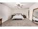 Spacious primary bedroom with ceiling fan, neutral carpet, and ample natural light at 1353 W Kiowa Ave, Mesa, AZ 85202