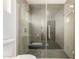 Glass enclosed shower with gray tile and modern fixtures, providing a spa-like experience at 1353 W Kiowa Ave, Mesa, AZ 85202