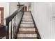 Stylish staircase showcasing decorative risers and a sleek, dark-stained handrail at 1353 W Kiowa Ave, Mesa, AZ 85202