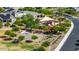The aerial shot showcases a community playground, a basketball court, and surrounding homes, perfect for Gathering-friendly living at 15276 W Latham St, Goodyear, AZ 85338