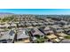 This aerial shot shows a vast residential area with solar panels, showcasing the community's growth and sustainability efforts at 15276 W Latham St, Goodyear, AZ 85338