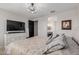 Spacious bedroom featuring neutral walls, large bed, dresser, and ensuite bathroom at 15276 W Latham St, Goodyear, AZ 85338