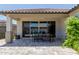 This spacious covered patio is perfect for outdoor dining, featuring a large dining table and easy access to the indoors at 15276 W Latham St, Goodyear, AZ 85338