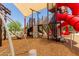 Well-equipped playground with climbing features, slides, and overhead shades, perfect for active play and safe recreation at 15276 W Latham St, Goodyear, AZ 85338