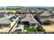 Stunning backyard showcasing a patio, bar, grill, green space, and privacy fence with mountain views at 15276 W Latham St, Goodyear, AZ 85338