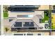 Overhead view of the backyard showcasing travertine patio, synthetic grass, grill, and privacy at 15276 W Latham St, Goodyear, AZ 85338