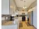 Modern kitchen featuring stainless steel appliances, granite countertops, and ample cabinet space at 15505 N 135Th Dr, Surprise, AZ 85374