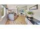 Inviting living room features a cozy fireplace, modern decor, and an open floor plan to the kitchen at 15505 N 135Th Dr, Surprise, AZ 85374