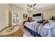 Spacious bedroom with a ceiling fan, a TV, and direct access to an en suite bathroom at 15505 N 135Th Dr, Surprise, AZ 85374