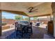 Outdoor patio has ample seating areas with a view of the pool, perfect for relaxing and entertaining guests at 15505 N 135Th Dr, Surprise, AZ 85374