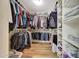 Organized walk-in closet with ample storage space for clothing and shoes, maximizing storage at 15505 N 135Th Dr, Surprise, AZ 85374